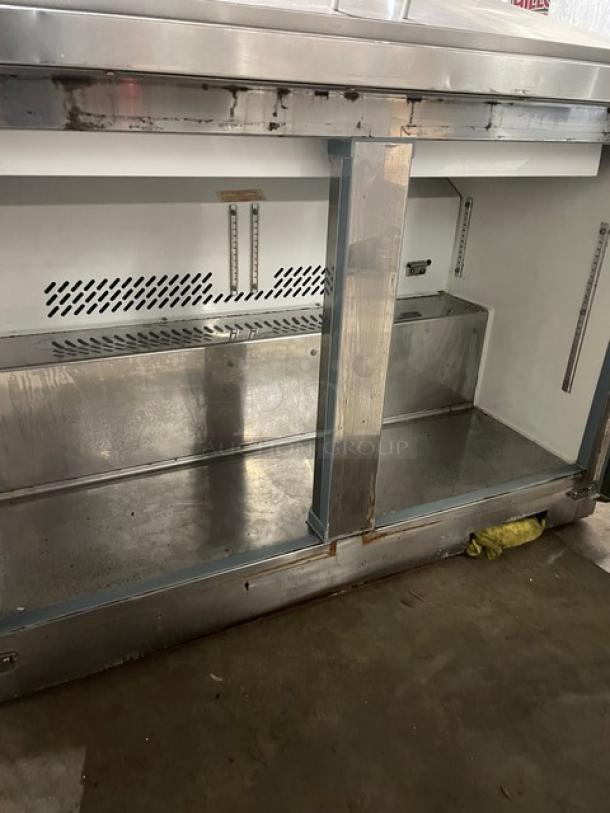 Entree S48MT stainless steel 2-door refrigerated prep table; bain marie style; interior view; commercial use.