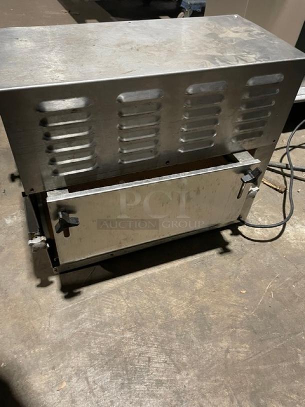 Somerset commercial stainless steel electric compact dough moulder in good condition, vents on top, power cord attached.