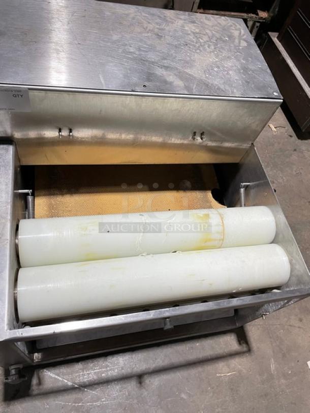 Somerset commercial stainless steel electric dough moulder, compact design, visible rollers, excellent condition.