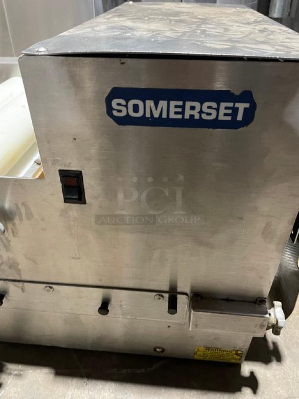 Somerset commercial stainless steel dough moulder, electric-powered, compact design, visible control switch, used condition.