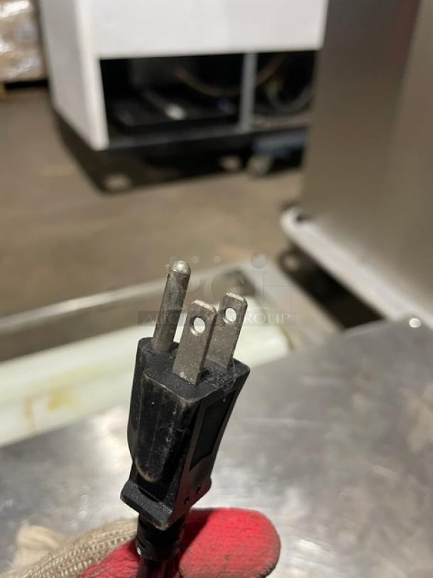 Alt text: Somerset Commercial Stainless Steel Dough Moulder power plug, indicating electric operation and compact design suitability.