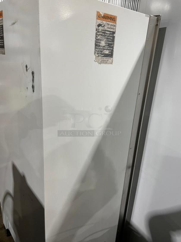 Sub-Zero Model 601RS commercial stainless steel refrigerator, single door, reach-in, with visible wear, warning label.