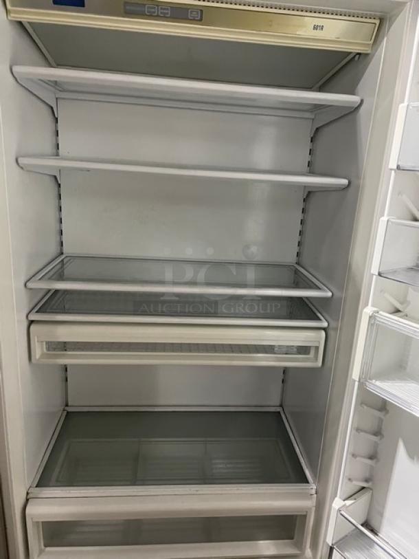 Sub-Zero 601RS commercial stainless steel refrigerator with glass shelves and digital controls, in good condition. Model SN: M1575697.