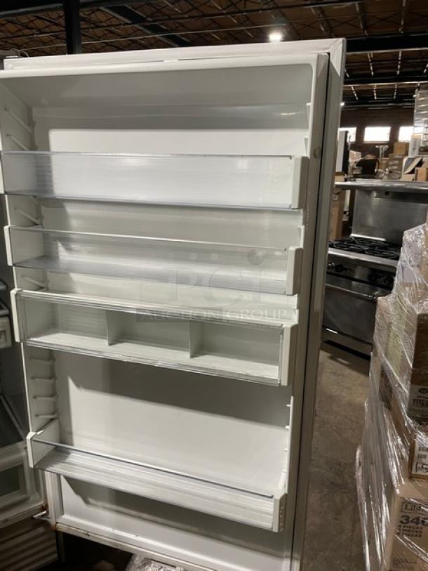 Sub-Zero Model 601RS stainless steel single-door refrigerator. Features multiple storage shelves. Clean interior. Serial: M1575697.