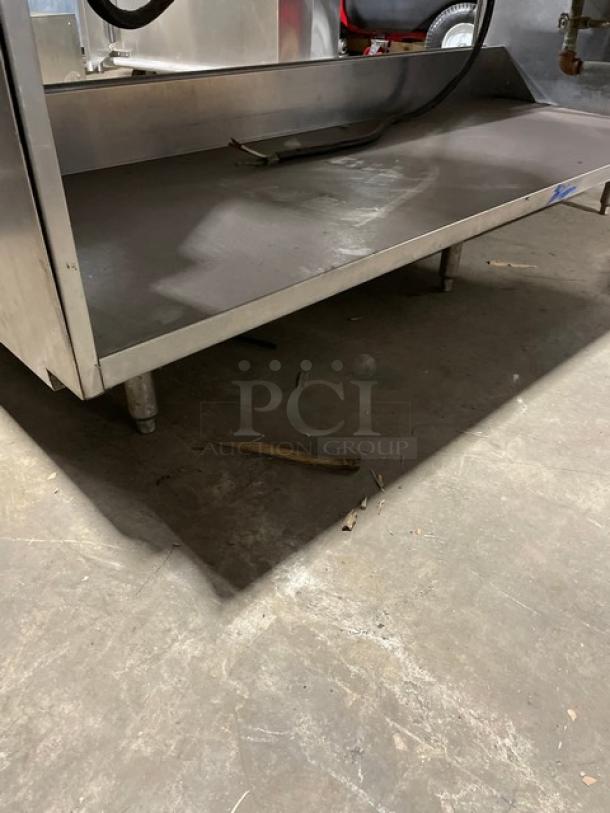 Delfield stainless steel gas-powered 5-well heated steam table with lower tray slide, single undershelf, and up-turned backsplash.
