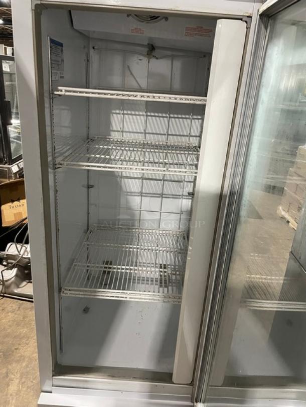 Beverage-Air CFG241 commercial freezer with single glass swing door, poly-coated wire racks, and visible interior labels.