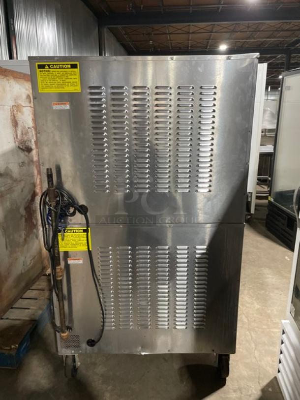 Vulcan SG4D1 commercial stainless steel double stacked convection oven, natural gas, with wired rack, on casters.