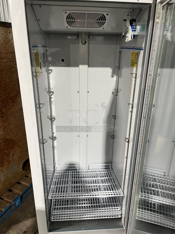 ABS Commercial single glass door refrigerator, model PHABTHCS16GDJA, with poly coated rack, on casters, in excellent condition.