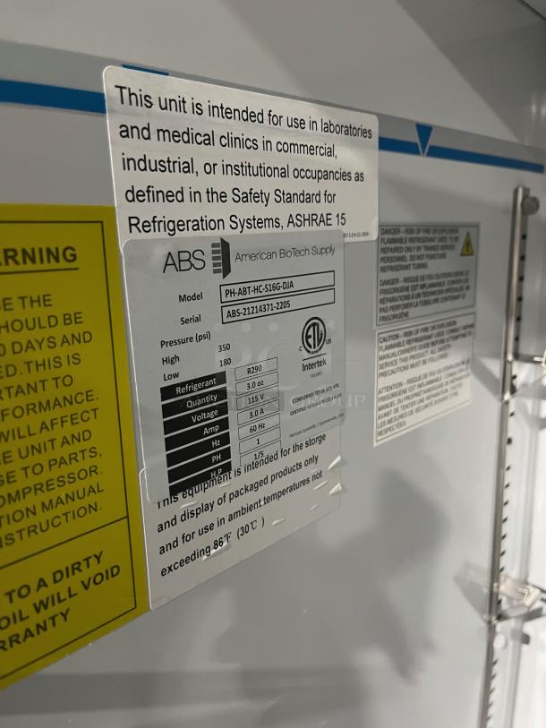 ABS Commercial White Single Glass Door Refrigerator, Model PH-ABT-HC-S16G-DJA, with poly-coated wire rack, on casters.