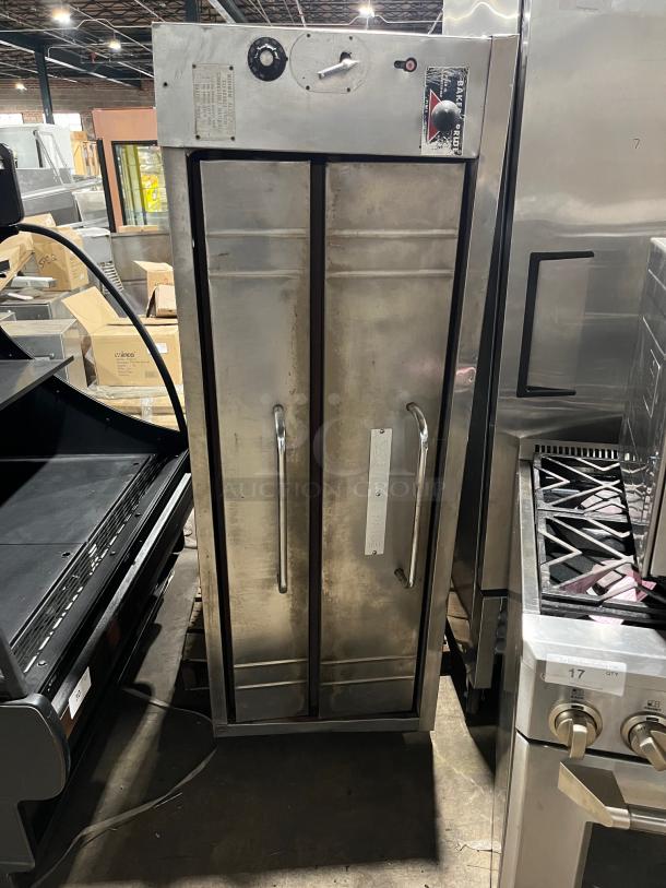Bakers Pride commercial stainless steel double-stacked pizza deck oven, natural gas powered, features control panel and brand label.