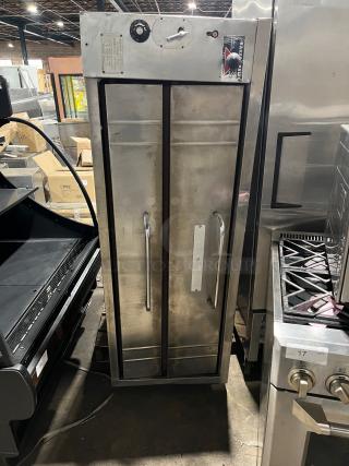 Bakers Pride commercial stainless steel double-stacked pizza deck oven, natural gas powered, features control panel and brand label.