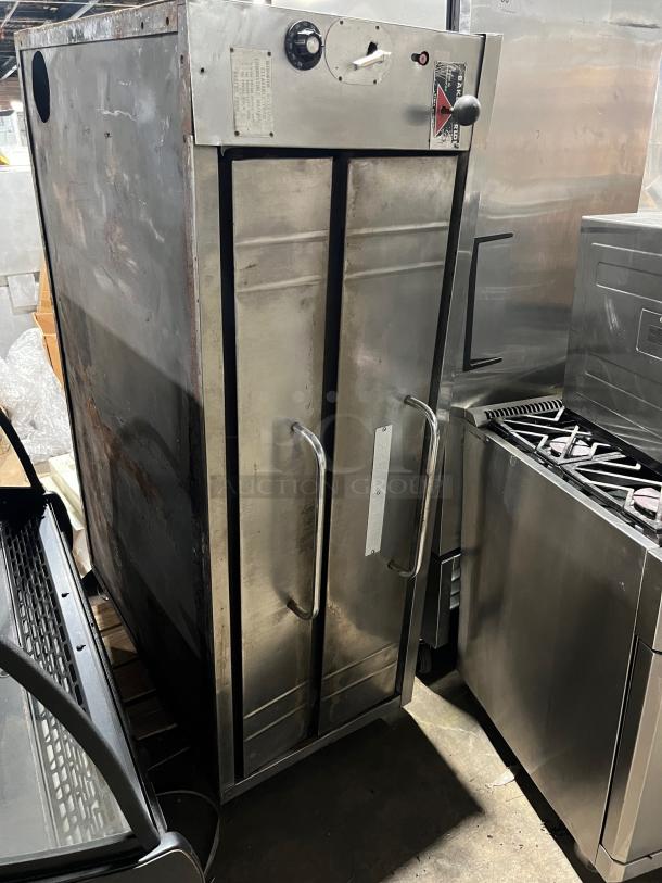 Bakers Pride stainless steel double-stacked pizza deck oven, natural gas powered, commercial use, visible wear, temperature dials.