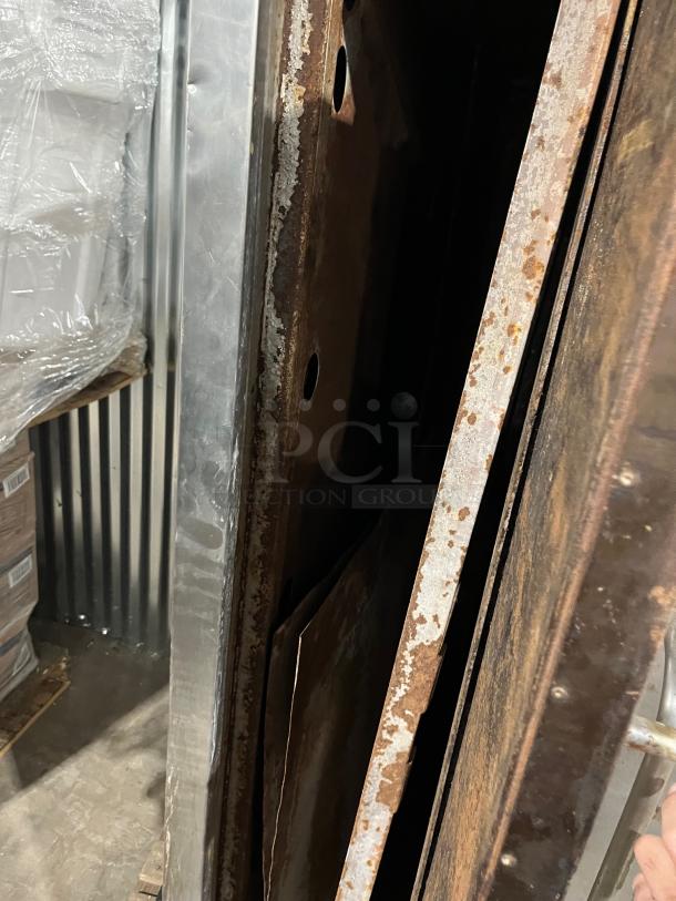 Bakers Pride double stacked pizza deck oven, stainless steel, natural gas, visible rust, used condition.