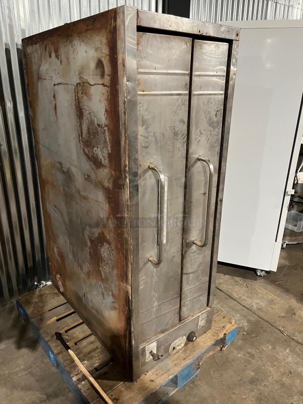 Bakers Pride stainless steel natural gas double stack pizza deck oven, used, visible rust and wear, auction item on pallet.