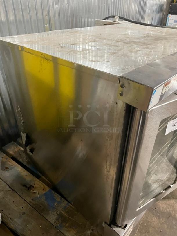 Vulcan commercial stainless steel natural gas single stack convection oven with wired rack, visible wear, sturdy build.