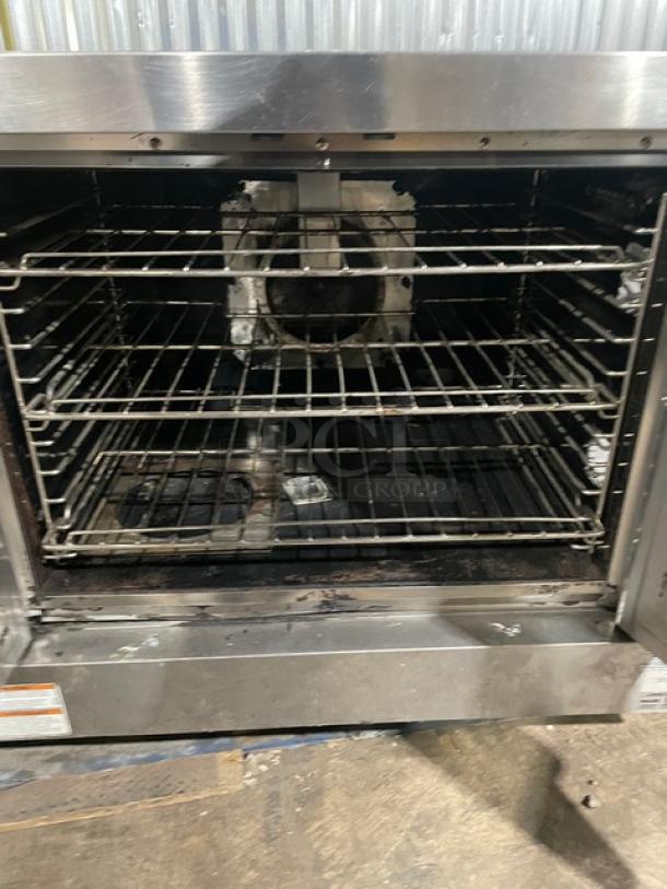 Vulcan commercial stainless steel natural gas convection oven with wired rack, single stack, used condition.