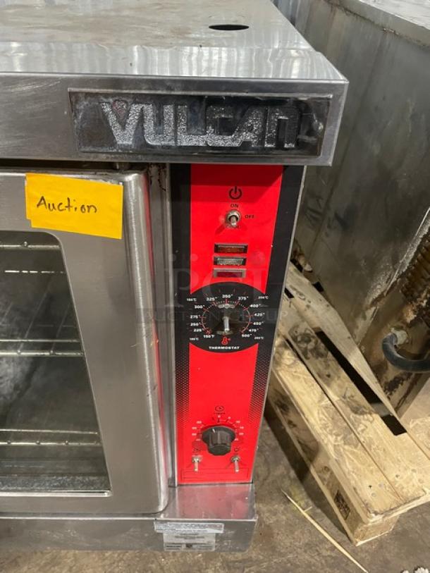 Vulcan commercial stainless steel natural gas convection oven with wired rack. Features control panel, auction label visible.