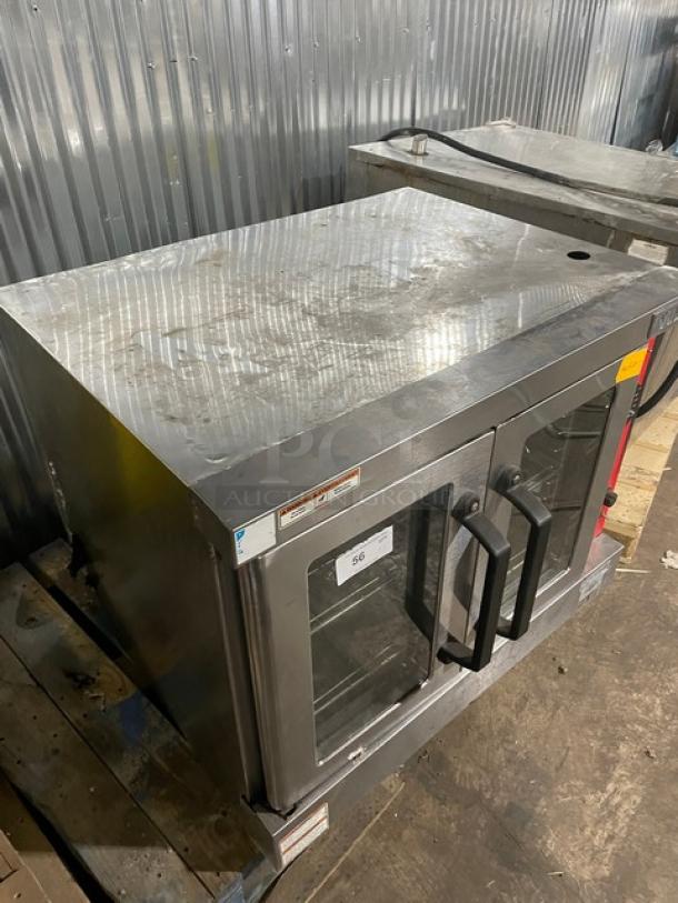 Vulcan stainless steel natural gas convection oven, single stack; includes wired oven rack. Used condition.