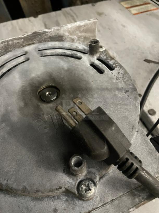 Vulcan commercial stainless steel natural gas convection oven with wired rack, visible power plug, moderate wear.