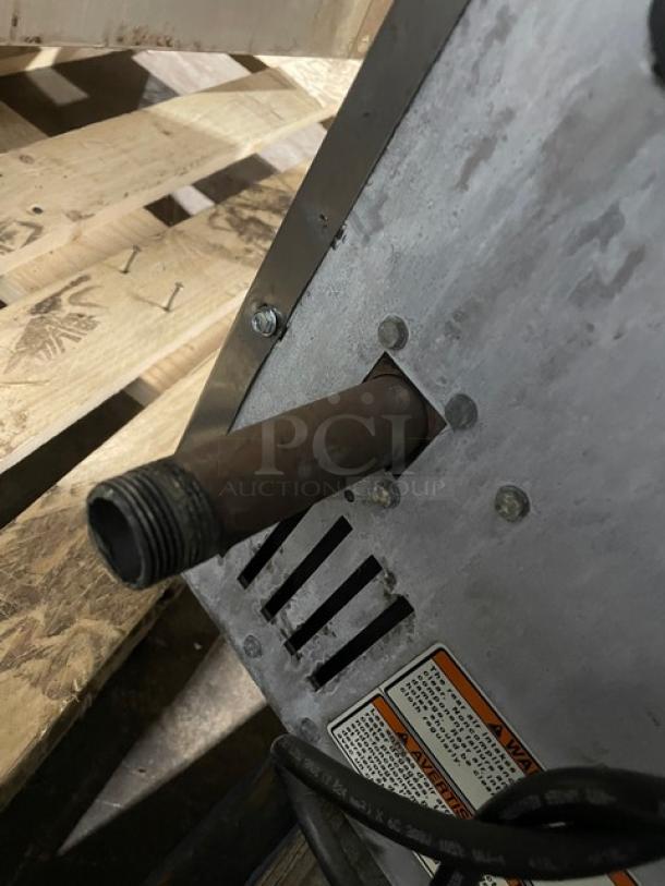 Vulcan commercial stainless steel convection oven, natural gas powered, featuring wired oven rack. Visible vent and safety label.