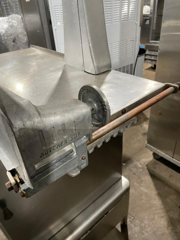 Butcher Boy commercial stainless steel electric meat band saw, free-standing with sturdy legs, heavy-duty condition.