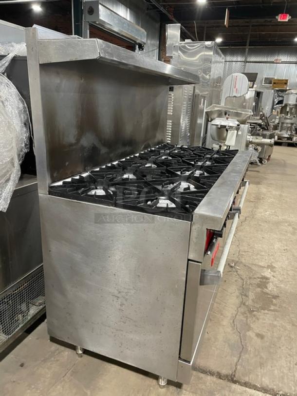 Vulcan commercial 10-burner range with double oven, stainless steel, natural gas, backsplash, overhead salamander shelf, wired rack.