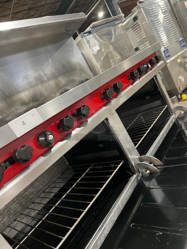 Vulcan commercial stainless steel 10-burner range with double oven combo, backsplash, overhead salamander shelf, and wired oven rack.