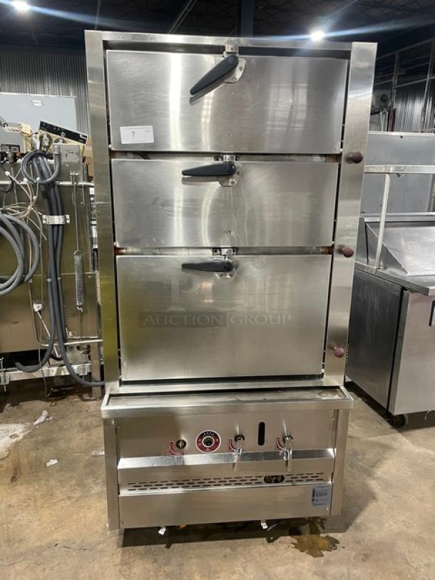 Commercial stainless steel 3-compartment seafood steamer, natural gas powered, with individual controls, wired oven rack, on legs.