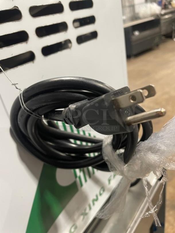 Commercial stainless steel electric ice cream machine, model ICM12, 110V, countertop design, single-flavor, with power cord.