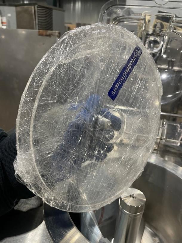 Stainless steel electric ice cream machine lid, wrapped, with model ICM12 label visible. In excellent condition.