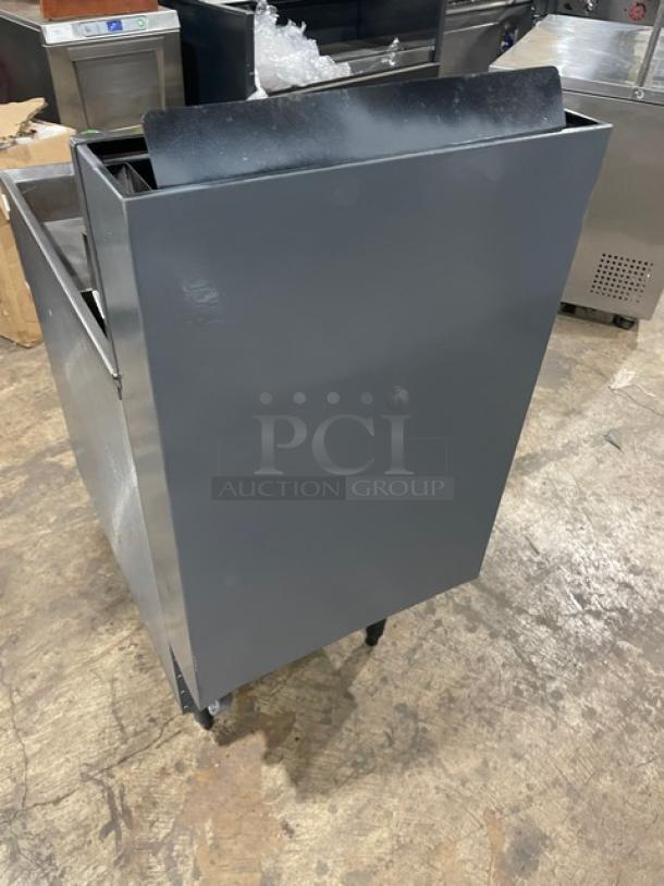 Commercial stainless steel natural gas deep fryer on legs, with back splash and basket hanger. Includes fry basket.