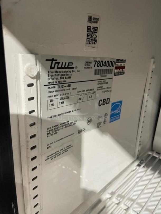 True Commercial 2-Door Refrigerator, Model TUC-48, stainless steel, Energy Star, with overhead shelf, poly coated rack, on casters.