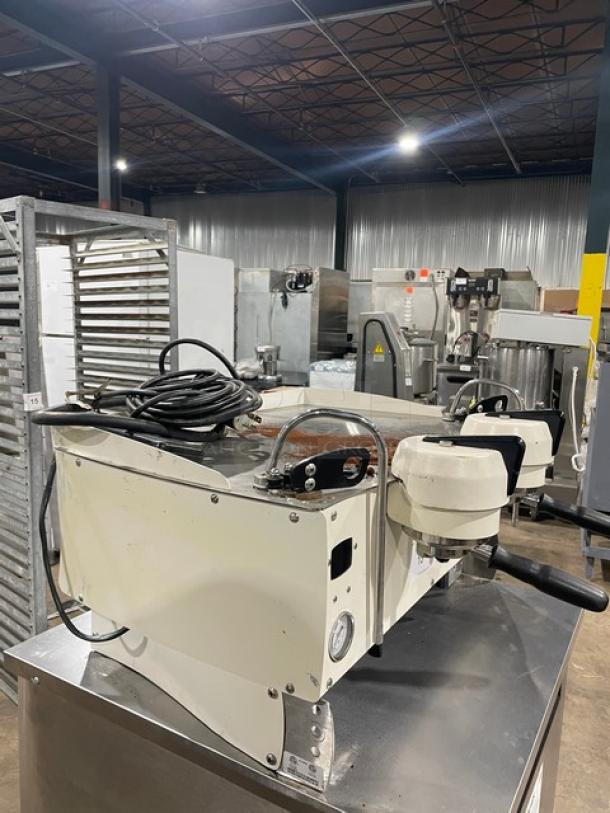 Synesso S200 Series white two-group espresso machine with steam wand, electric-powered, countertop design.