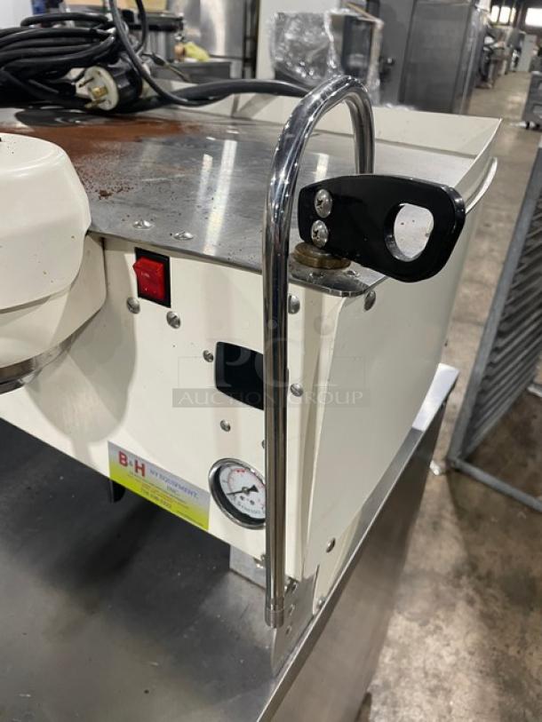 Synesso S200 Series white commercial espresso machine, electric-powered, two-group with steam wand, slight wear, visible gauge, tags.