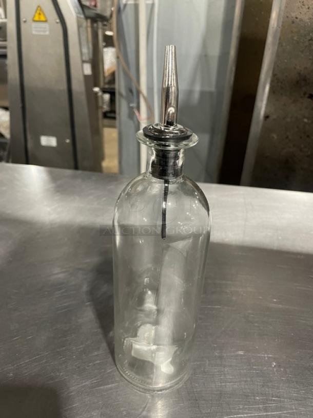 TableCraft 18 oz clear glass oil and vinegar cruet bottle, model 10375, with stainless steel pourer, new condition.