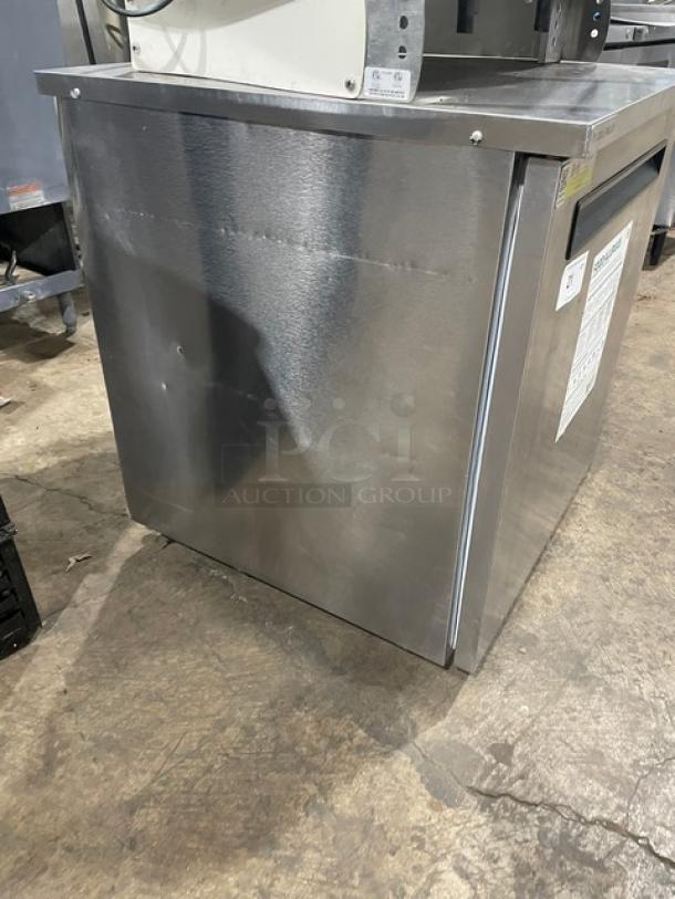 Delfield 406P-STAR2 stainless steel undercounter refrigerator, single door, on casters, 115V, with visible condition marks.