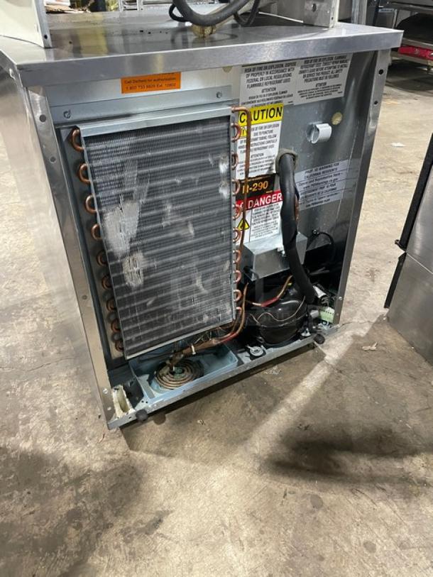 Delfield 406P-STAR2 stainless steel undercounter fridge, single door, 115V, on casters, showing internal components and labels.