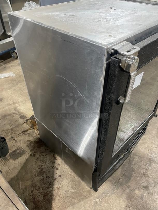 Glastender 2018 commercial mug chiller, model MVF24GNL. Stainless steel, black door, poly-coated wire racks, 120V.
