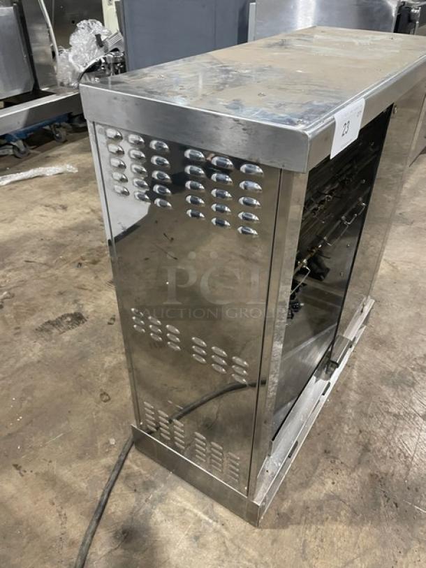Robot Coupe stainless steel electric rotisserie cabinet with countertop design and sturdy legs, in used condition.