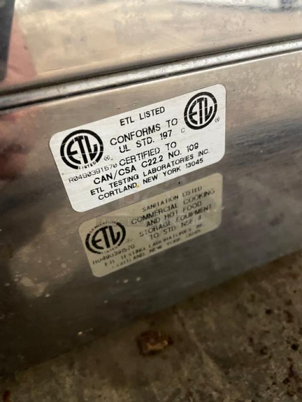 Robot Coupe commercial stainless steel rotisserie cabinet, electric powered, countertop model with legs. ETL listed, complies with UL STD. 197.