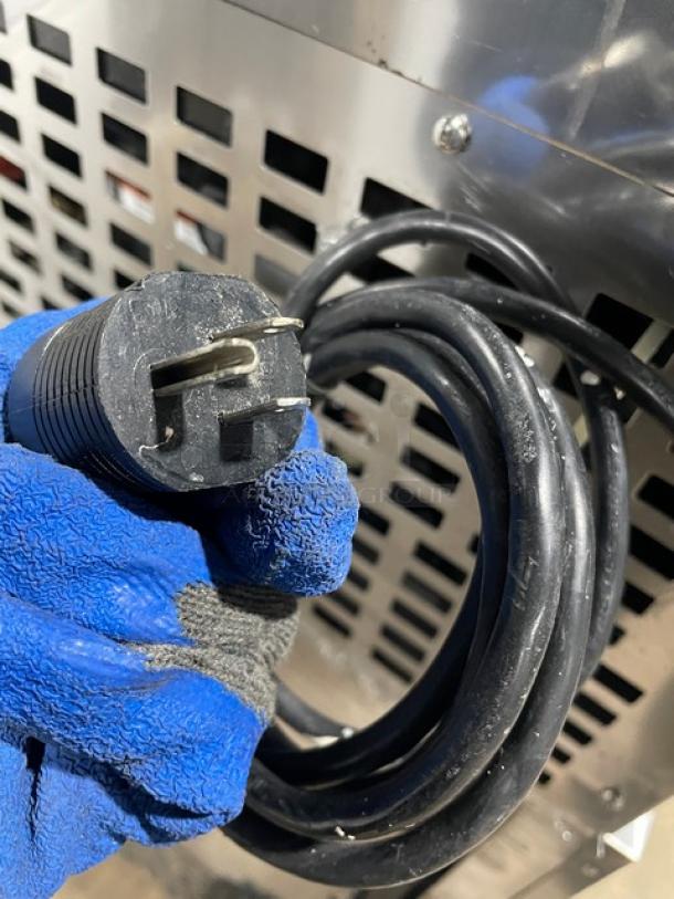 Follett REF5 medical-grade undercounter refrigerator plug, showing 115V connection, stainless steel exterior.