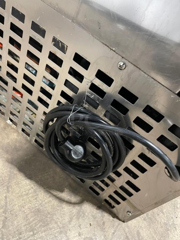 Follett REF5 commercial stainless steel undercounter refrigerator, medical-grade. Includes poly coated wire rack. Model REF5, SN: E13997-27113. 115V, 1 Phase.