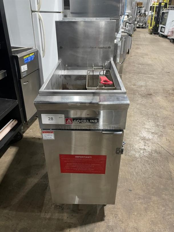 Cookline commercial stainless steel gas deep fat fryer with back splash and fry basket, on legs. Appears in good condition.