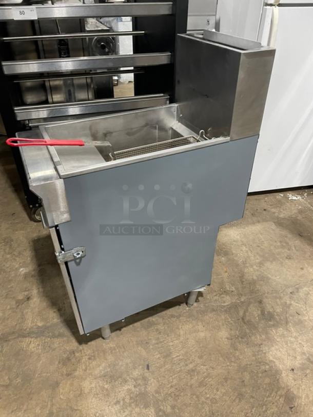 Cookline commercial stainless steel gas fryer with back splash, fry basket, and sturdy legs. Features durable construction.