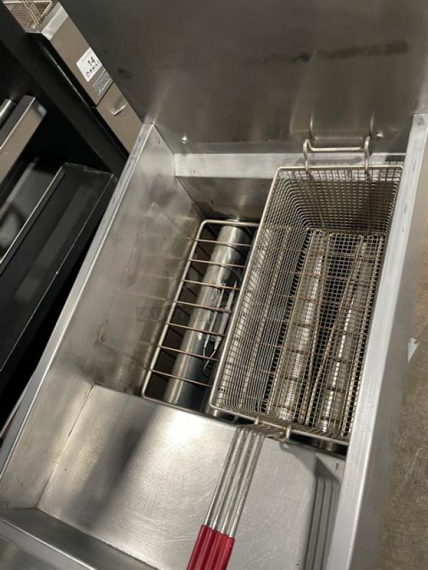 Cookline stainless steel gas deep fat fryer with back splash, fry basket, and legs. Features durable construction.