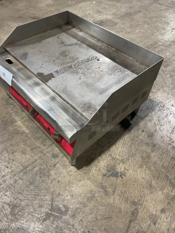 Avantco 24" stainless steel electric countertop griddle, model 177EG24N, with back and side splash, sitting on legs.