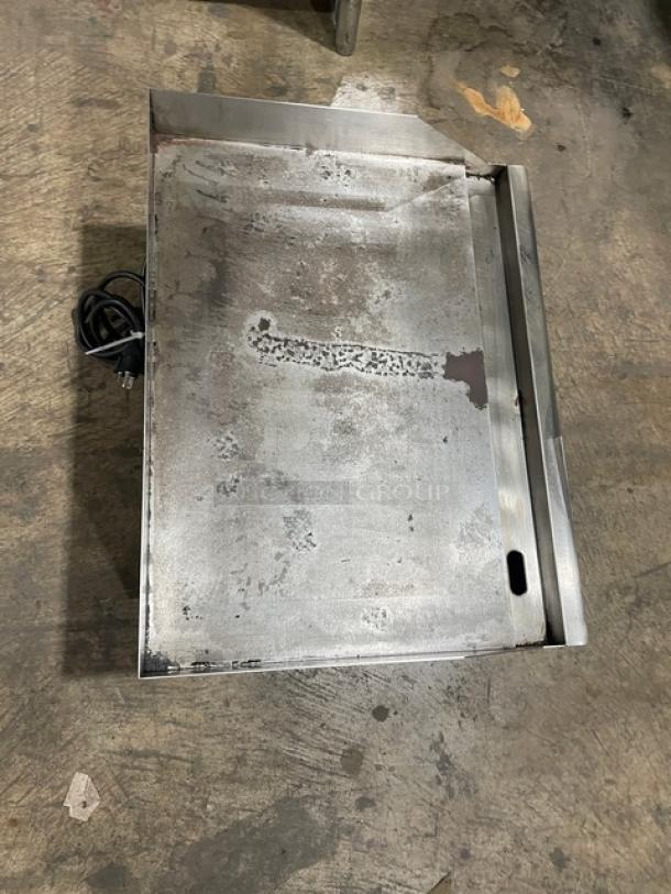 Avantco 177EG24N stainless steel 24" flat griddle, used condition, with back and side splash, on legs, 208/240V power cord.