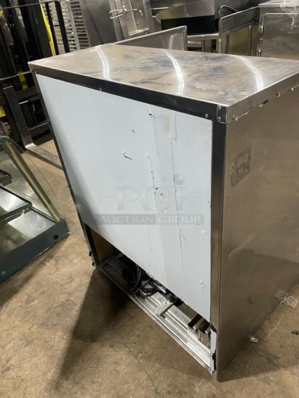 Cooltech stainless steel refrigerated open merchandiser, commercial-grade, used condition, visible wear, no tags or labels.
