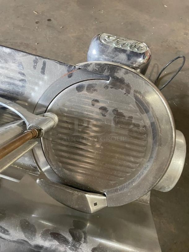 Globe Model 500 commercial electric deli meat slicer, countertop design, one phase, on legs, visible wear and markings.