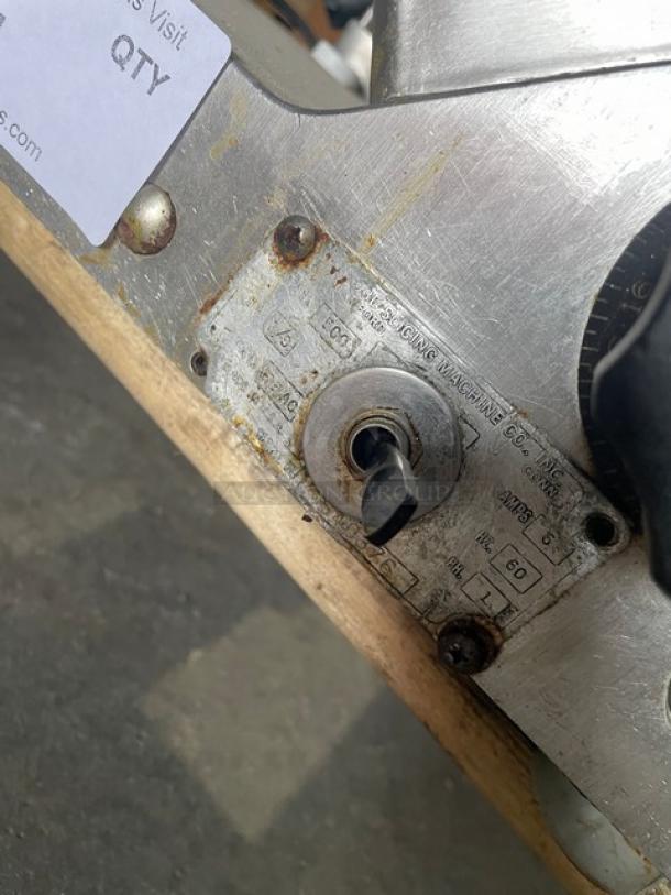 Globe Model 500 electric deli slicer, countertop design on legs. Visible wear and markings; includes control dial and power label.